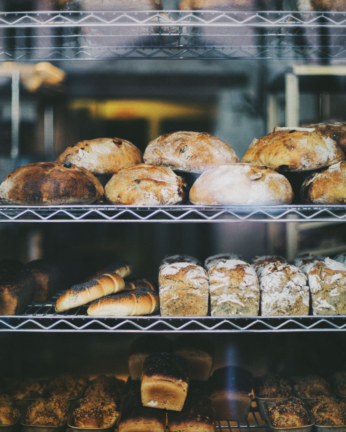 A market stall of bread and pastries with Edinburgh stone buildings behind